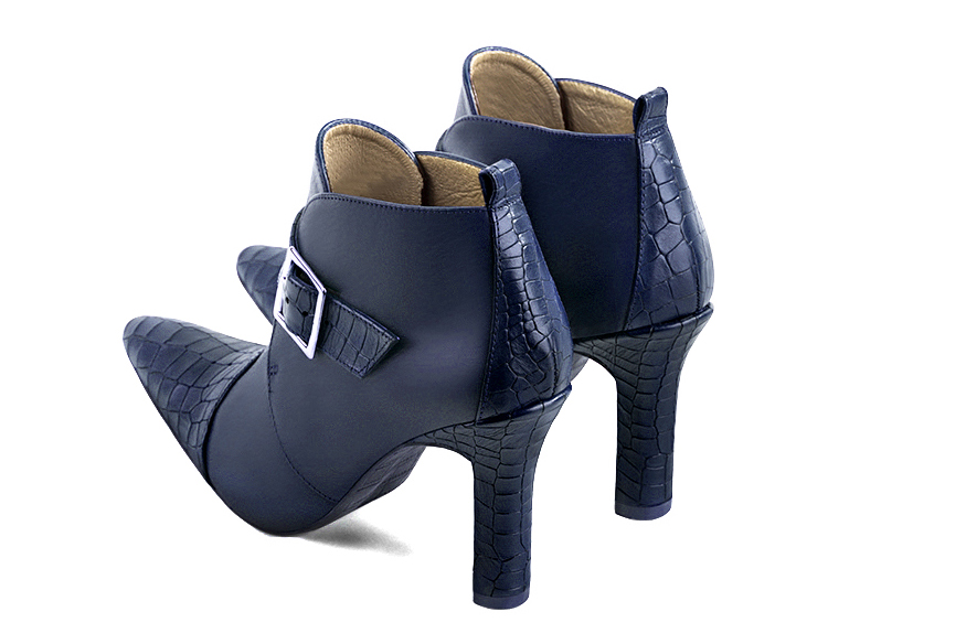 Navy blue women's ankle boots with buckles at the front. Tapered toe. Very high kitten heels. Rear view - Florence KOOIJMAN